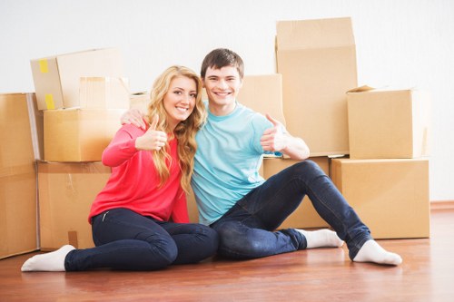 Professional movers loading furniture into a van