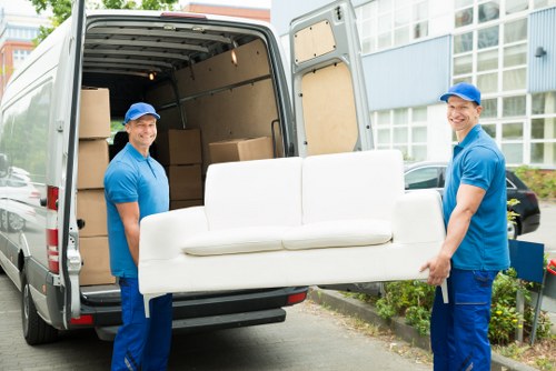 Professional movers organizing office equipment during a Kingston business relocation