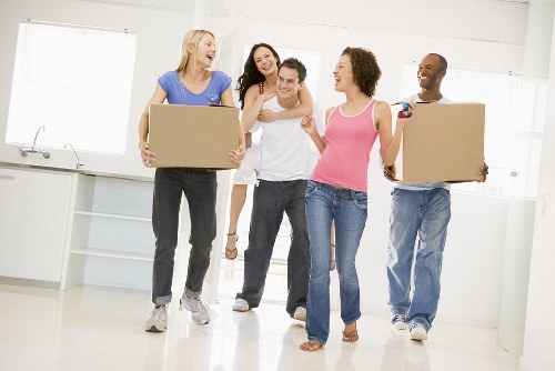 Planning home moves in Kingston with packed boxes and moving van