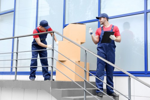 Professional removal team handling boxes during a Kingston home move