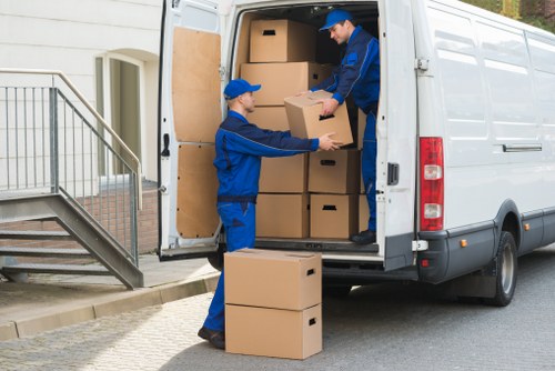 Professional house removals in Kingston with moving boxes and van