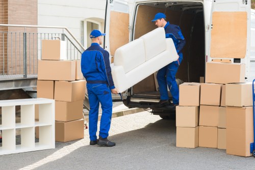 Furniture removal team handling bulky home items in Kingston