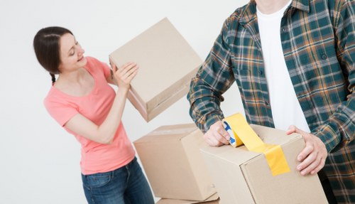 Commercial relocation team handling furniture and electronics for an office move in Kingston
