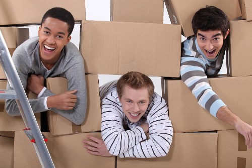 Boxes and small furniture prepared for a Kingston student move