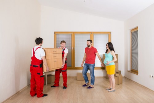 Professional movers transporting furniture in Kingston