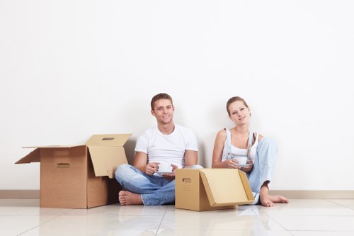 Removal team handling furniture safely during a house move