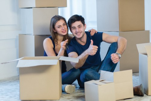 Trained movers preparing items with care inside a property