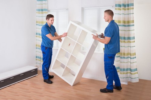 Professional movers loading office items during commercial moves in Kingston