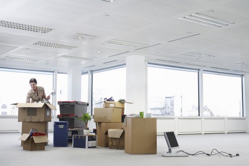 Commercial relocation service with boxes and desks in Kingston