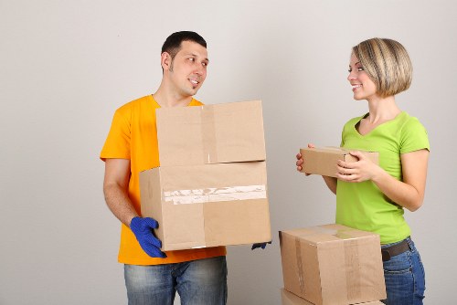 Local piano movers protecting floors during a Kingston house move